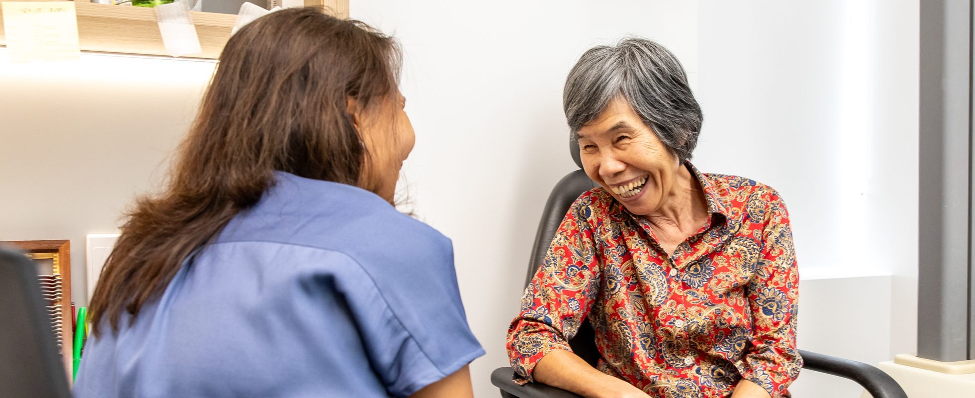 Eastwood Eye Surgery clinician discussing cataract surgery with a patient in the consulting room