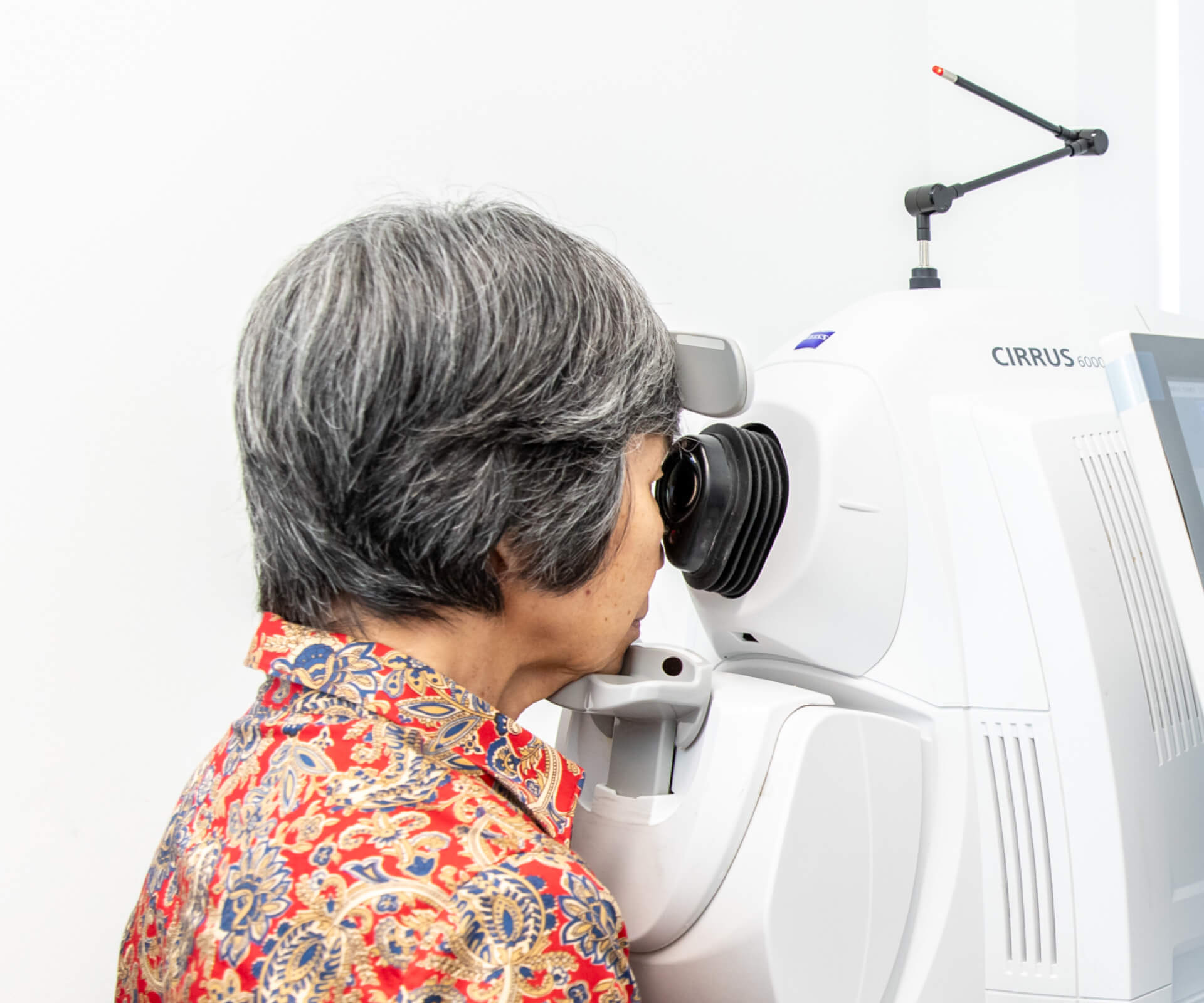 Eastwood Eye Surgery ophthalmologist examining a patient's eye at the slit lamp during a cataract assessment