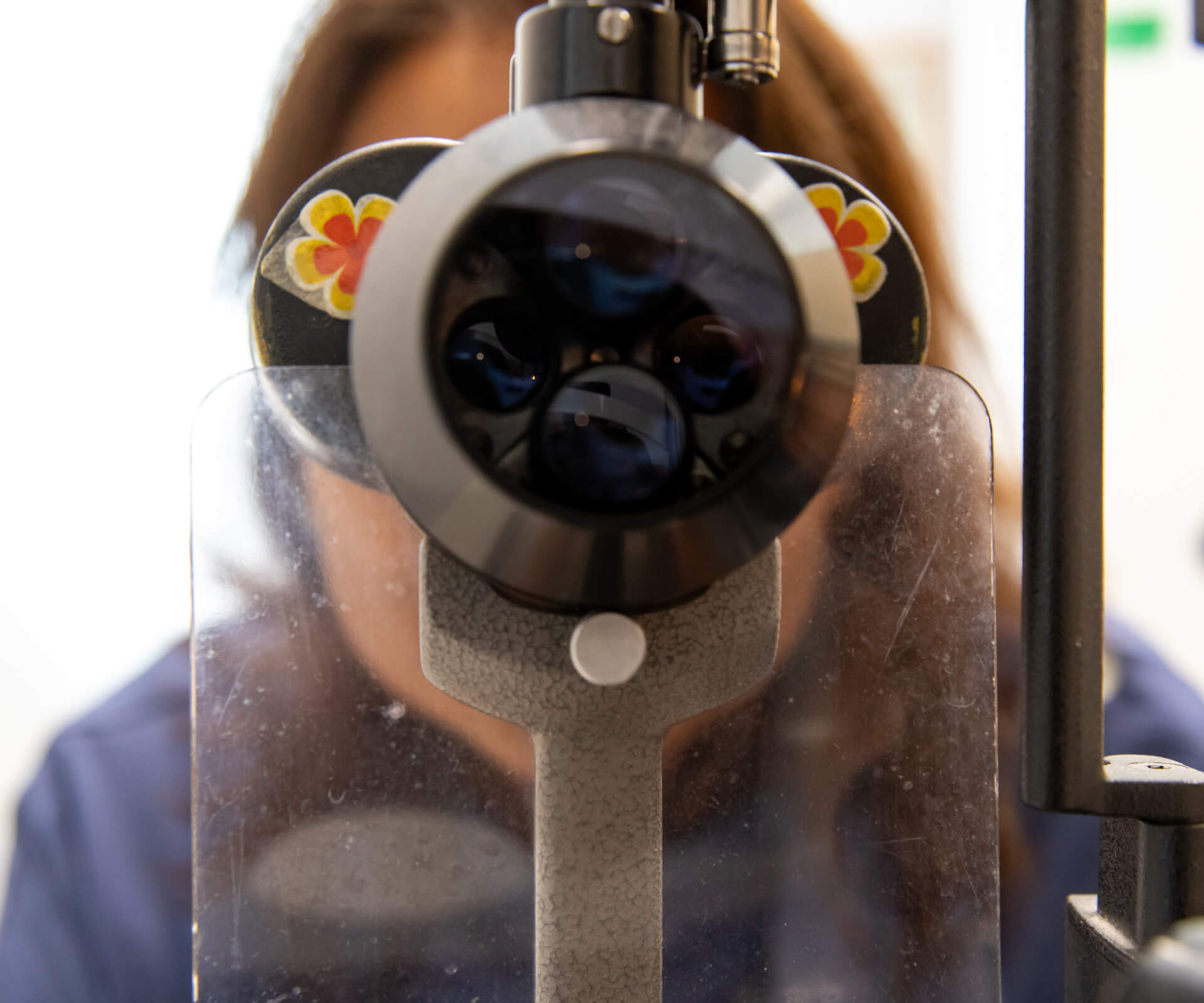 Eastwood Eye Surgery ophthalmologist examining a patient's eye at the slit lamp during a cataract assessment