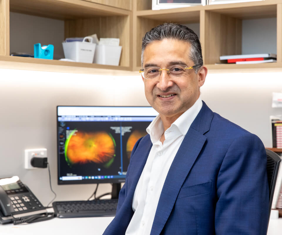 Eastwood Eye Surgery ophthalmologist examining a patient's eye at the slit lamp during a cataract assessment